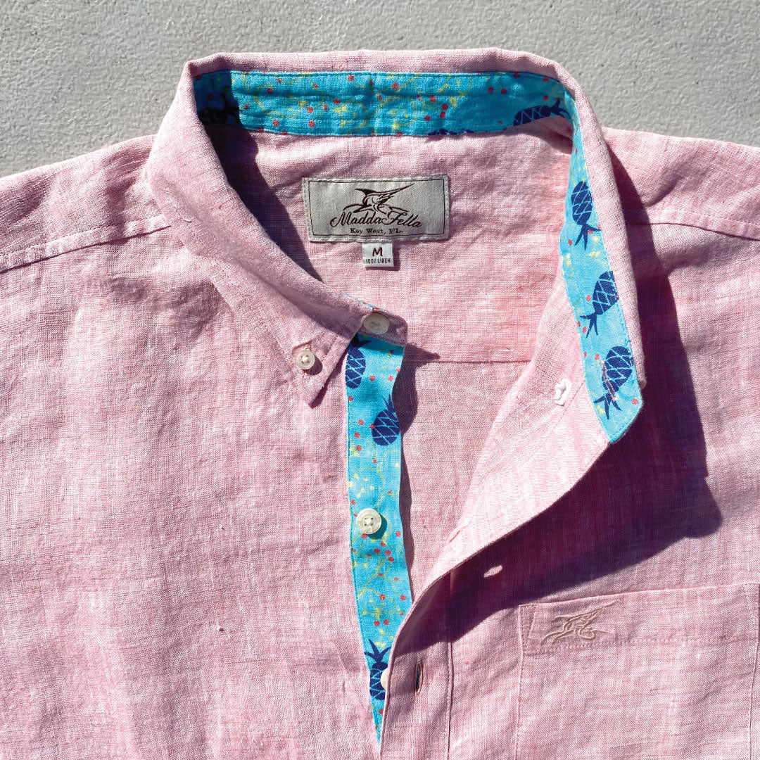 Island Coral/Pineapple Print ++ pink long sleeve linen shirt with blue cuffs and pineapple accents