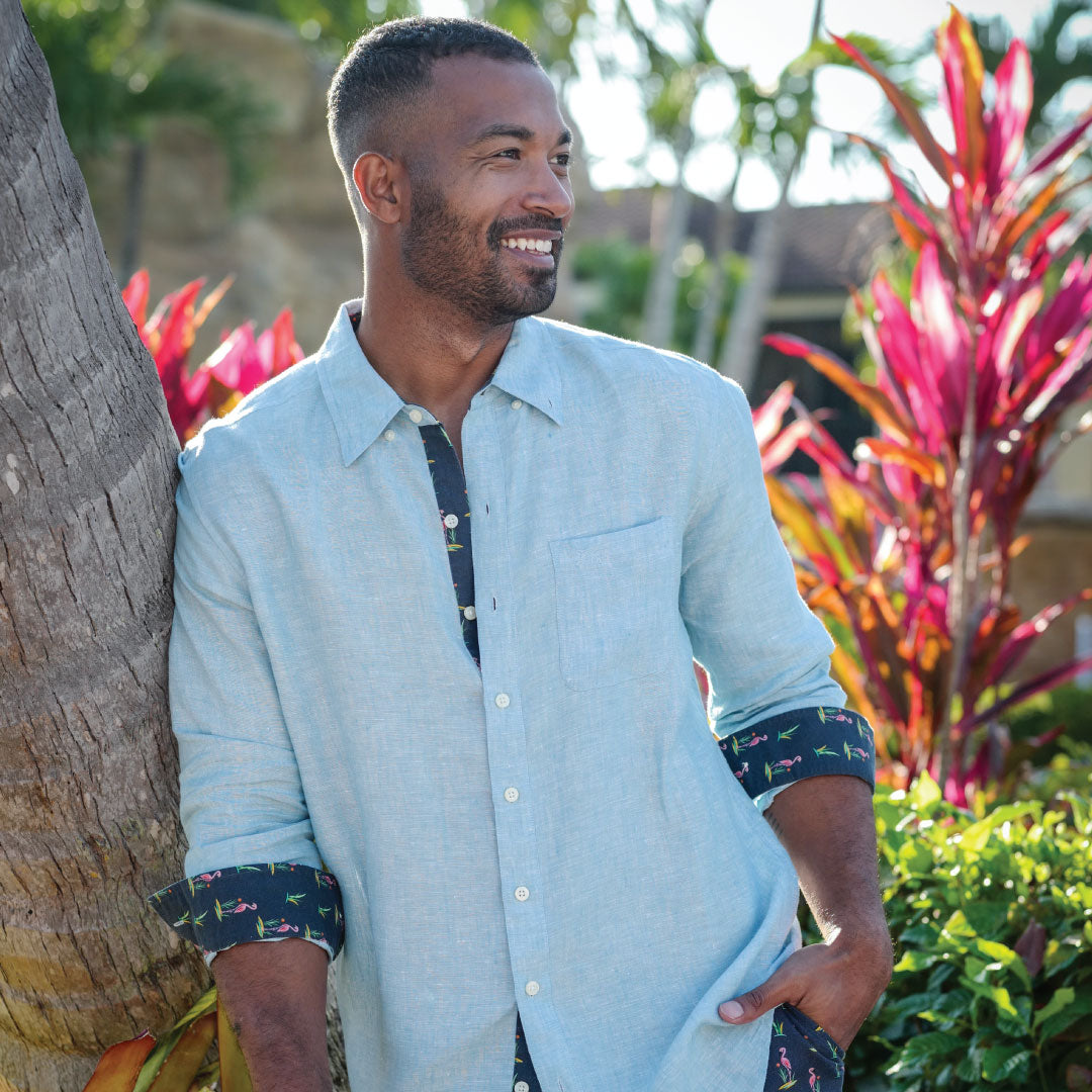 Caribbean Blue/Flamingo Print ++ Man-Wearing-Caribbean-Blue-Linen-Shirt-Flamingo-Accent-Cuffs